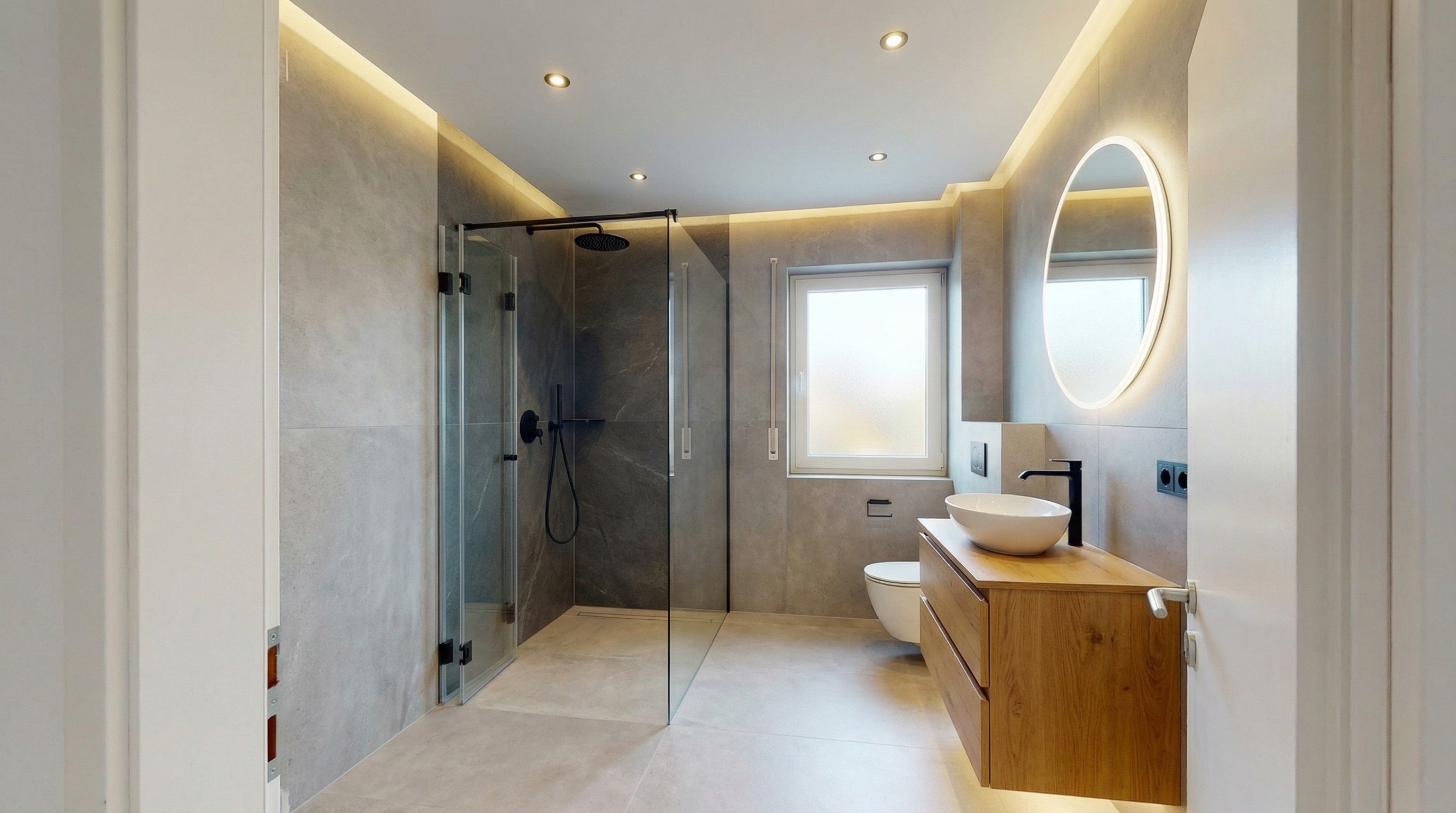 Modernes Badezimmer nach Komplettsanierung durch Bauvia